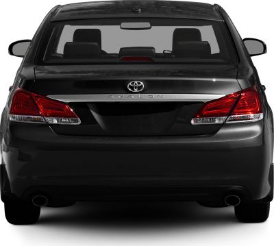 Rear view with tail lights, chrome trim, and dual exhaust pipes
