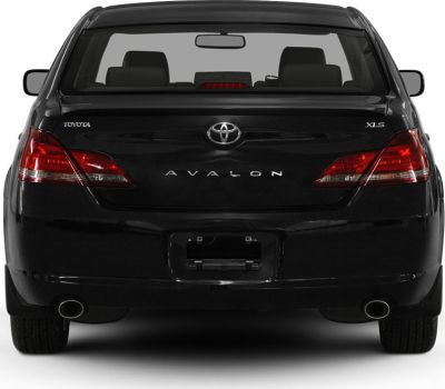 Rear view of sedan with dual exhaust and distinct tail lights