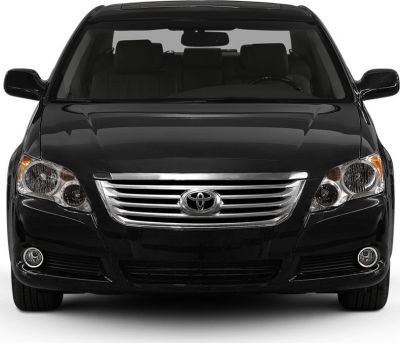 Front view with horizontal chrome grille and dual headlight design