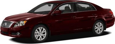 Dark red midsize sedan showing side profile and front grille