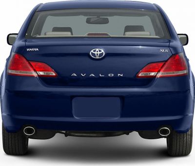 Rear view with dual exhaust pipes and distinctive taillights