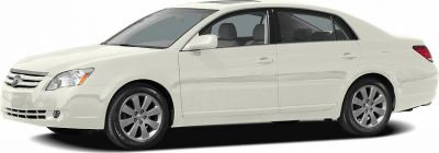 White sedan side profile with alloy wheel rims