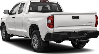 Rear side view of white dual cab pickup with tailgate and towing hitch
