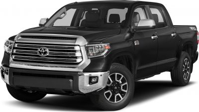 Black four-door pickup with chrome grille and alloy wheels