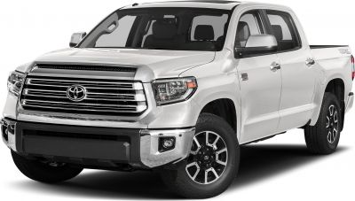 Front grille and black alloy wheels on a 4-door pickup truck.