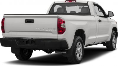 Rear view of white single cab long bed pickup with red taillights