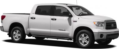 Side view of a white extended crew cab pickup with alloy wheels