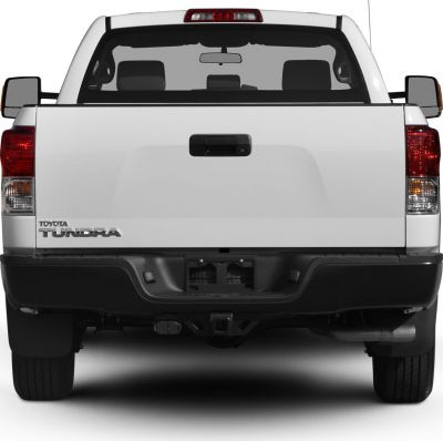 Rear view of truck tailgate and lights with towing hitch