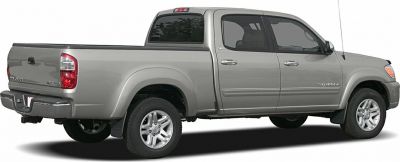 Side view of a silver double cab pickup with rear bed and alloy wheels