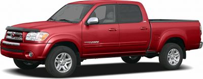 Red double cab pickup truck side view with alloy wheels and extended cab