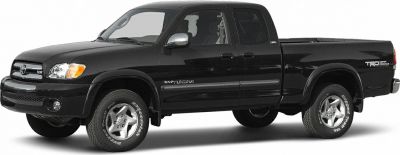 Black pickup truck with access cab and off-road tires.