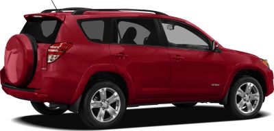 Rear side view of red SUV with spare tire on tailgate.