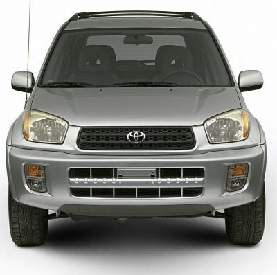 Front view with grille, headlights, and roof rails of an early 2000s SUV