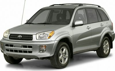 Front side view of silver mid-size SUV with roof rails and alloy wheels.