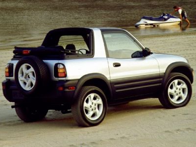 Compact SUV with convertible soft top roof and side profile