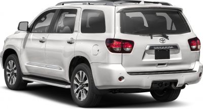Rear side view of full-size SUV with alloy wheels and roof rails