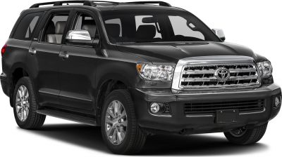 Large SUV with chrome grille, roof rails, and multi-spoke wheels