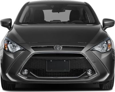 Honeycomb hexagonal grille with sharp headlights and fog lights.