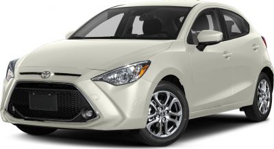Front-side view of compact hatchback with prominent grille and alloy wheels