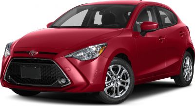 Front-side view with headlights, honeycomb grille and alloy wheels