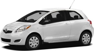Side profile of a compact white two-door hatchback car