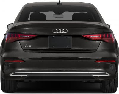 Rear view showing sleek tail lights and rear bumper design.