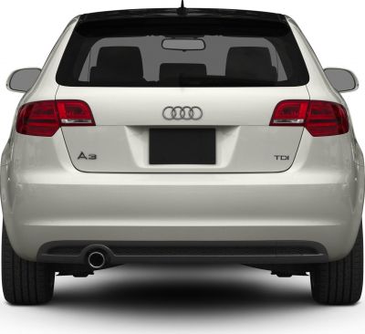 Rear view with exhaust pipe, tail lights, and badges