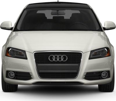 Front view with grille, headlights, and fog lights.