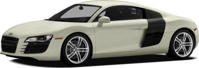 Front-side view of sleek sports coupe with distinctive side air intake and alloy wheels.