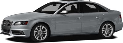 Gray four-door luxury sedan with sporty alloy wheels and aggressive front grille
