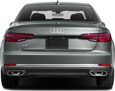Rear view with distinctive tail lights and dual exhausts