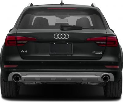 Rear view with dual exhaust, roof rails, and distinctive taillights