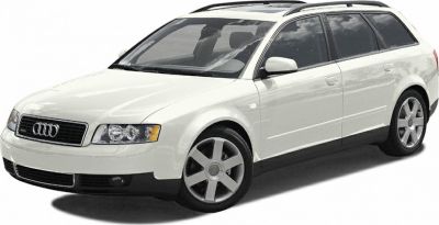 White station wagon with distinctive alloy wheels and roof rails