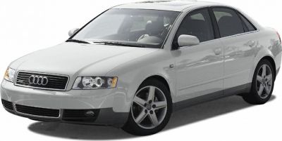 Front side view of a sedan with distinctive headlights and alloy wheels
