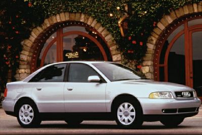 Silver sedan side profile with alloy wheels and clean lines