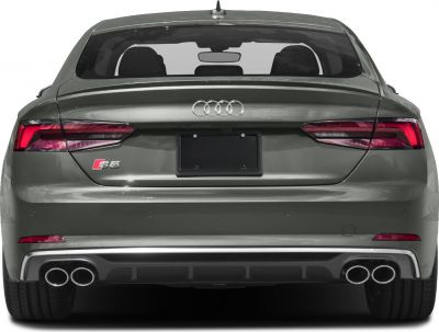 Rear view with quad exhausts, LED taillights, and Audi emblem