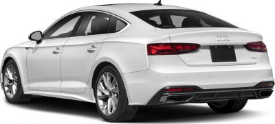 Rear view of white sedan highlighting tail lights and dual exhausts