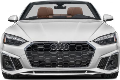 Front grille and headlights of a luxury convertible with visible brown seats