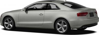 Silver two-door coupe with alloy wheels and dual exhausts rear view