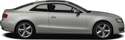 Side profile of silver two-door coupe with alloy wheels and smooth aerodynamic shape