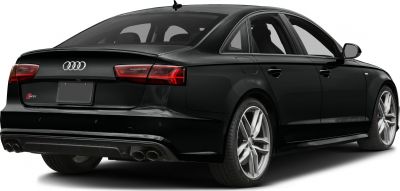 Rear three-quarter view with quad exhaust and angular taillights
