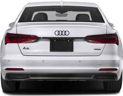 Rear view of a luxury sedan with LED tail lights and quattro badge