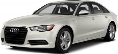 Front-side view of white luxury sedan with modern headlights and distinctive grille.