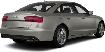 Rear view of sedan with dual exhausts and sleek taillights