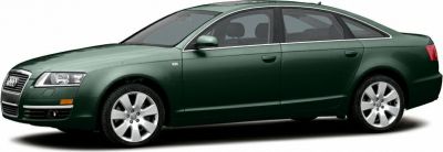 Side view of a sedan with alloy wheels and sleek exterior design.