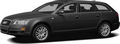 Side profile of black estate with alloy wheels and roof rails