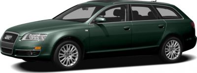 Green station wagon with sleek long roof and alloy wheels