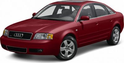 Red four-door sedan with five-spoke alloy wheels, front side angle
