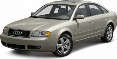 Front-side view of beige sedan with alloy wheels and grille