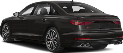 Rear three-quarter view with quad exhaust and alloy wheels